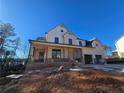 View of the new two-story home with a front porch and attached garage at 3677 Thornhill Ct, Douglasville, GA 30135