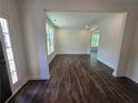 Bright living room featuring hardwood floors, white trim, and plenty of natural light at 3677 Thornhill Ct, Douglasville, GA 30135