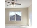Bedroom featuring a ceiling fan and large windows that provide ample natural light at 473 Broder Farms Dr, Stockbridge, GA 30281