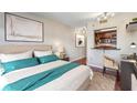 Cozy bedroom with plush bedding, modern decor, and a convenient pass-through to the adjacent kitchen at 1280 W Peachtree Nw St # 3414, Atlanta, GA 30309