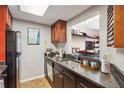 Well-equipped kitchen with stainless steel appliances and breakfast bar pass-through to the work area at 1280 W Peachtree Street Nw, Unit #3414, Atlanta, GA 30309