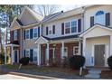 Charming townhome showcasing its covered porch and coordinated exterior color scheme at 902 Tree Creek Blvd # 2, Lawrenceville, GA 30043