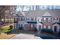 Well-maintained townhomes featuring varied architectural details and lush green spaces at 902 Tree Creek Blvd # 2, Lawrenceville, GA 30043