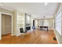 Inviting living room featuring hardwood floors, a modern fireplace, and ample natural light at 1031 Lindridge Ne Dr, Atlanta, GA 30324