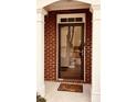 Charming front door surrounded by brick and columns welcomes guests into this home at 1290 Adcox Sq, Stone Mountain, GA 30088