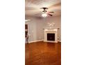 Cozy living room featuring a fireplace and hardwood floors providing an inviting atmosphere at 1290 Adcox Sq, Stone Mountain, GA 30088
