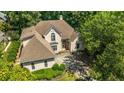 Aerial view showcasing a well-maintained property with lush greenery and a private driveway at 370 Royal Birkdale Ct, Duluth, GA 30097