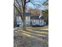 Inviting two-story home with blue exterior, complemented by mulched landscaping, a bench, and an American flag at 184 Cedarcrest Dr, Acworth, GA 30101