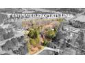 Aerial view showcasing the expansive property lines of the wooded lot with lake access at 260 Sandy Lake Cir, Fayetteville, GA 30214