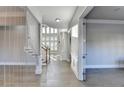 Bright foyer with hardwood floors and staircase at 3540 Paddocks Pkwy, Suwanee, GA 30024