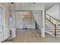 Beautiful foyer with hardwood floors and decorative chandelier at 3540 Paddocks Pkwy, Suwanee, GA 30024
