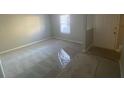 Bright living room with neutral carpet and a large window for natural light at 6104 Cobblestone Ct, Douglasville, GA 30134