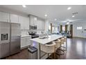 Spacious kitchen with a center island and stainless steel appliances overlooking the living area at 921 Ambient Sw Way, Atlanta, GA 30331