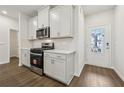 Modern kitchen featuring stainless steel appliances, white cabinetry, and beautiful countertops at 1705 Trout Lily Pl, Smyrna, GA 30126