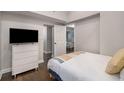 Modern bedroom featuring a flat screen television, closet, and minimalistic decor at 125 Warren Ne St, Atlanta, GA 30317