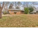 Traditional brick home with a well-manicured front yard, perfect for curb appeal at 3783 Brookcrest Cir, Decatur, GA 30032