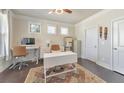Comfortable home office with a ceiling fan, bright natural light, and a neutral color scheme at 38 Water Oak Dr, Acworth, GA 30101