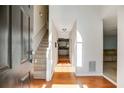 Inviting entryway with hardwood floors and view of staircase and living spaces at 4150 Soaring Dr, Douglasville, GA 30135