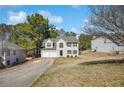 Charming two-story home featuring a two car garage and traditional architectural details at 4150 Soaring Dr, Douglasville, GA 30135