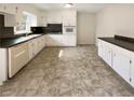 Spacious kitchen with white cabinets, stainless steel appliances, and ample counter space at 1793 Witt Cir, Austell, GA 30168