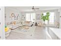 Bright living room featuring a comfortable sectional sofa, stylish decor, and ample natural light at 2758 Maddison Towns Ave, Norcross, GA 30071