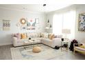 Bright and inviting living area showcasing stylish decor, a comfortable sofa, and a chic rug at 2758 Maddison Towns Ave, Norcross, GA 30071