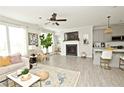 Open-concept space with a cozy fireplace, modern decor, and a seamless transition to the kitchen at 2758 Maddison Towns Ave, Norcross, GA 30071