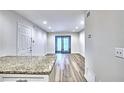 Bright living area with a view of a back patio through sliding glass doors and new floors at 2657 Lenox Ne Rd # 29-1, Atlanta, GA 30324