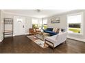 Bright living room featuring modern furnishings, hardwood floors, fresh paint, and abundant natural light at 517 Daniel Ave, Decatur, GA 30032