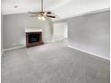 Spacious living room featuring plush carpet and fireplace, great for entertaining guests at 12 Bonnie Glen Ln, Hampton, GA 30228