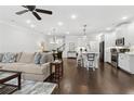 Open-concept home featuring a modern kitchen, dining area and living room with hardwood floors at 871 Dunning St, Marietta, GA 30060