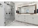 Main bath with marble floors, double vanity, and large glass enclosed walk-in shower at 871 Dunning St, Marietta, GA 30060