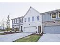 Newly constructed townhomes with a mix of painted brick and siding exteriors, complemented by well-maintained lawns at 205 Admor Ln, Acworth, GA 30102