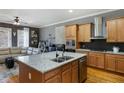 Stylish kitchen with an island, stainless steel appliances, hardwood floors and open to the living room at , Atlanta, GA 30363
