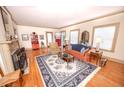 Cozy living room with hardwood floors, fireplace, large rug, and abundant natural light at 970 E Main St, Canton, GA 30114