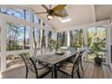 Charming sunroom with ceiling fan, skylight, multiple windows, and views of the surrounding trees at 741 Bentwood Trce, Alpharetta, GA 30005