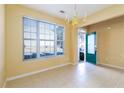 Inviting dining room with tile flooring, neutral paint, and natural light from a window at 1378 Penhurst Dr, Lawrenceville, GA 30043