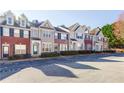 Attractive townhome exteriors featuring brick and neutral siding with manicured landscaping at 1378 Penhurst Dr, Lawrenceville, GA 30043