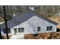 Back exterior view with a door, multiple windows, siding, and AC unit at 359 Cannongate Rd, Sharpsburg, GA 30277