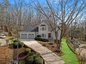 Beautiful home with a three car garage, landscaped front yard, and a walkway to the front door at 4170 Summit Way, Marietta, GA 30066