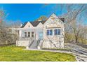 Charming white home with a lovely front porch and a well-manicured lawn at 1337 M L King Jr Nw Dr, Atlanta, GA 30314