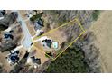 Aerial view of a lovely home with a pool and large lot in a desirable neighborhood at 75 Horseshoe Dr, Covington, GA 30014