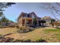 Charming brick home with well-maintained lawn and mature landscaping at 4065 Balsam Bark Dr, Cumming, GA 30028