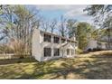Well-maintained two-story home with mature trees in a serene setting, offering curb appeal at 505 S Malton S Ct, Stone Mountain, GA 30083