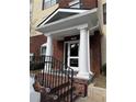 Welcoming condo building entrance with columns and decorative details at 1965 Nocturne Dr # 1103, Alpharetta, GA 30009