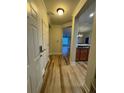 Inviting condo foyer with hardwood floors and open layout to the living area at 1965 Nocturne Dr # 1103, Alpharetta, GA 30009