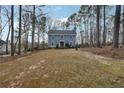 Expansive front yard of home with mature trees offering shade and privacy at 710 Melanie Ct, Canton, GA 30115