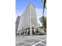 Exterior view of a tall building, highlighting its architecture and urban setting at 57 Forsyth St # 13D, Atlanta, GA 30303