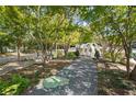 Landscaped courtyard with seating areas and walking paths under mature trees at 10 Perimeter Summit Ne Blvd # 2112, Atlanta, GA 30319