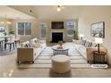 Bright, virtually staged living room with fireplace, modern furnishings, and an open floor plan at 40 Zebulon Pl, Covington, GA 30016